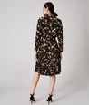 Model is wearing UNTUCKit Janice dress in black.