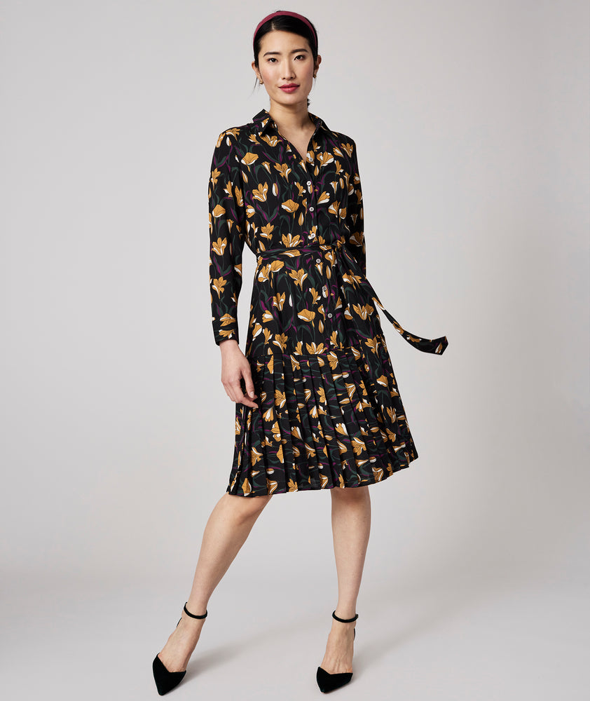Model is wearing UNTUCKit Janice dress in black.