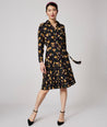Model is wearing UNTUCKit Janice dress in black.