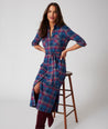 Model is wearing UNTUCKit Joni plaid navy dress.