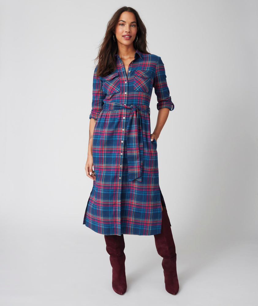 Model is wearing UNTUCKit Joni plaid navy dress.