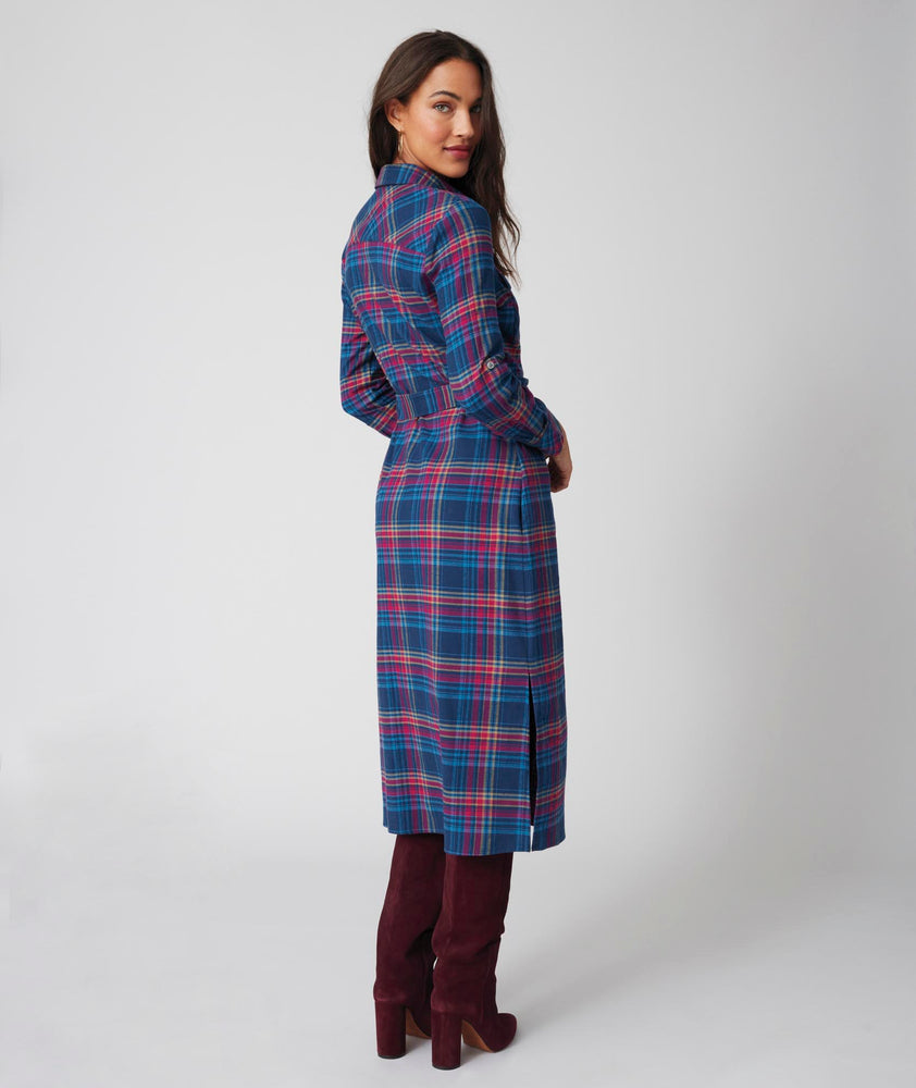 Model is wearing UNTUCKit Joni plaid navy dress.