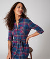 Model is wearing UNTUCKit Joni plaid navy dress.