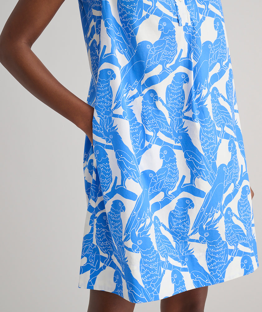 Model is wearing UNTUCKit Jordan printed birds dress in blue. 