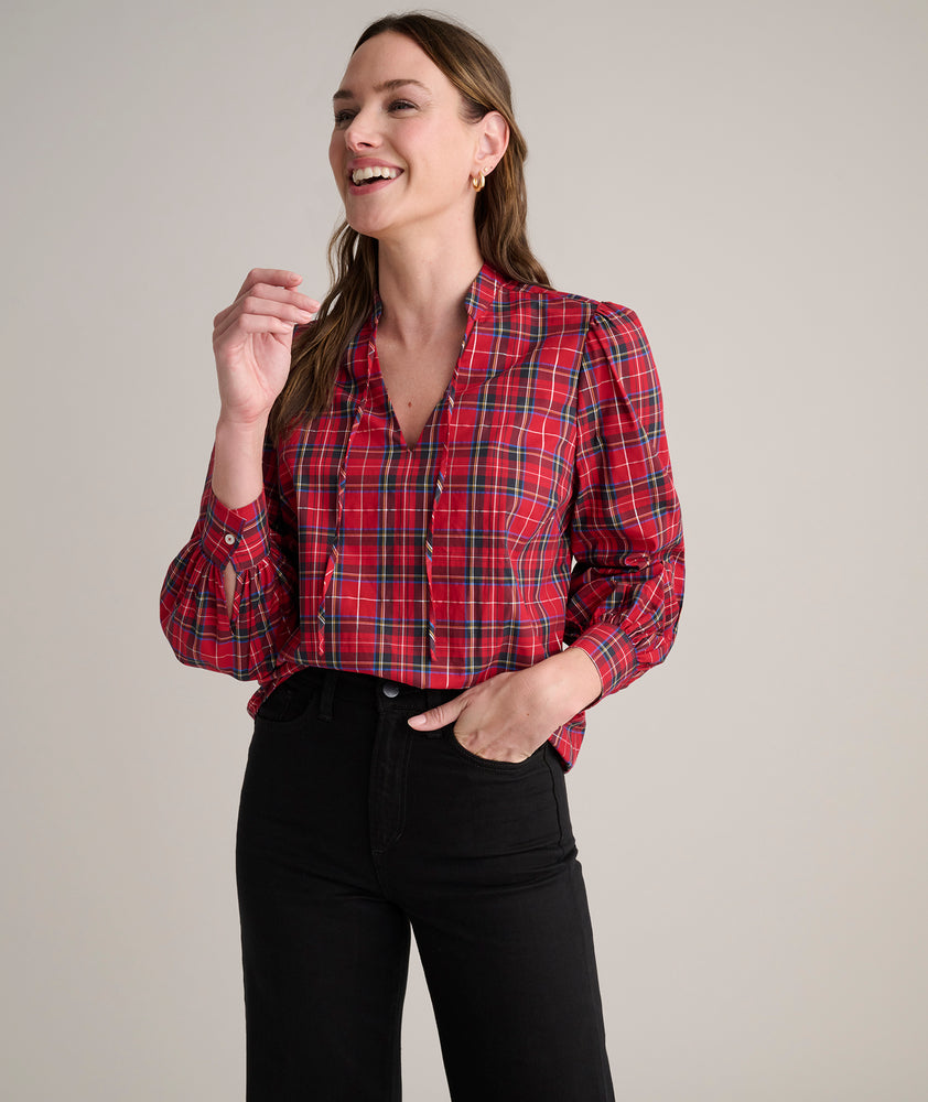 Model is wearing UNTUCKit Joy shirt in red plaid. 