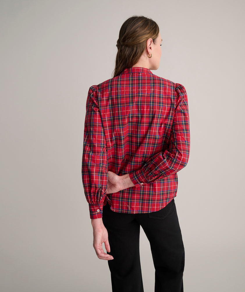 Model is wearing UNTUCKit Joy shirt in red plaid. 