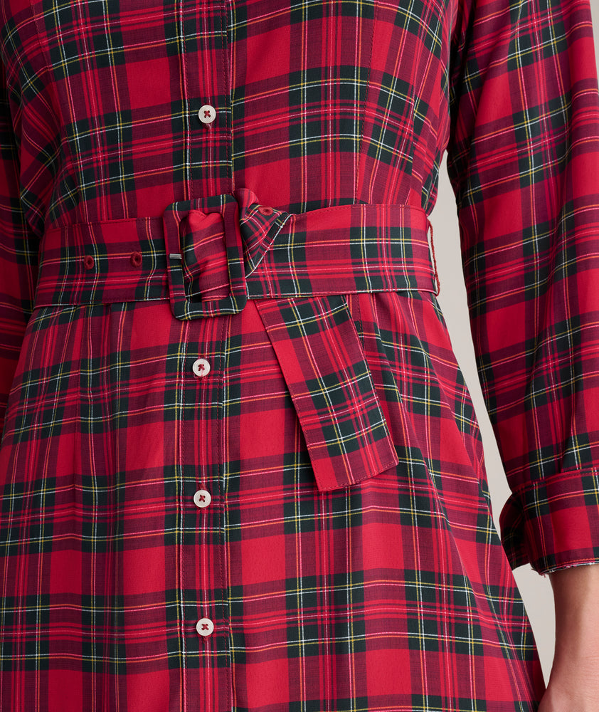 Model is wearing UNTUCKit Judy dress in plaid. 