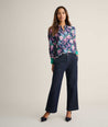 Model is wearing UNTUCKit Twill Viscose Paisley Juliet Blouse. 
