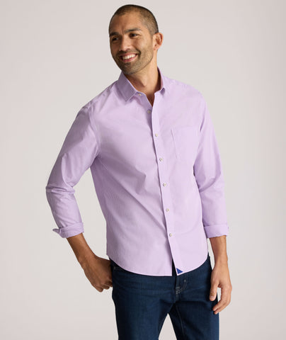 Model is wearing UNTUCKit Kelly wrinkle free shirt in purple gingham.