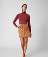 Model is wearing UNTUCKit Kendall brown skirt. 