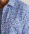 Model is wearing UNTUCKit Kincaid shirt in blue floral print. 
