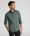 Model is wearing UNTUCKit CottonTek Kleinwood Shirt in green and black plaid. 