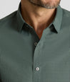 Model is wearing UNTUCKit CottonTek Kleinwood Shirt in green and black plaid. 