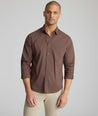 Model is wearing UNTUCKit CottonTek Brachetto Shirt in brown gingham. 