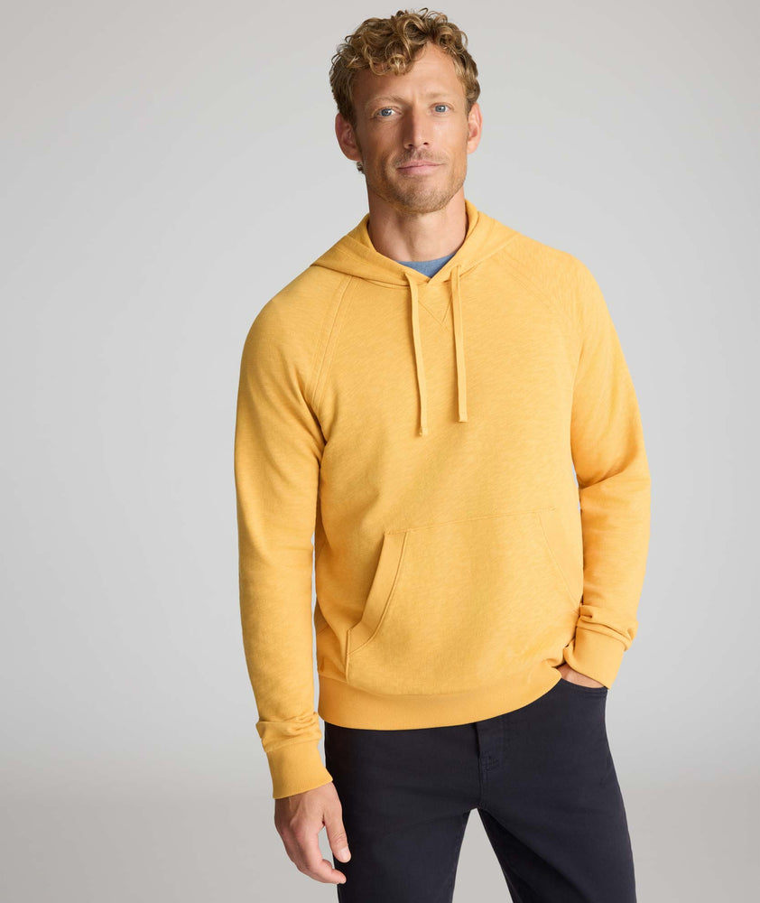 Model wearing an UNTUCKit Hoodie in yellow.