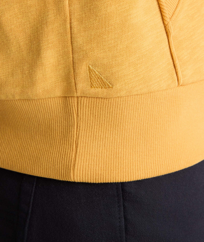 Model wearing an UNTUCKit Hoodie in yellow.