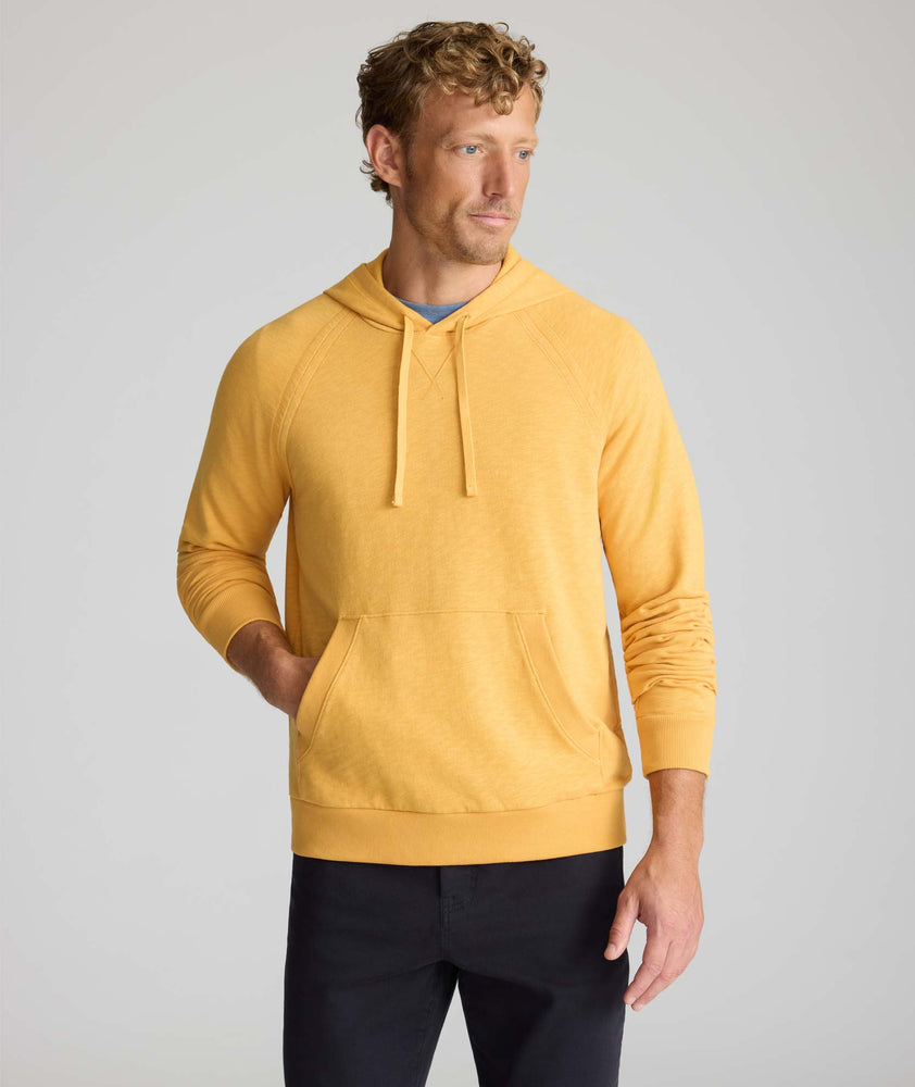 Model wearing an UNTUCKit Hoodie in yellow.