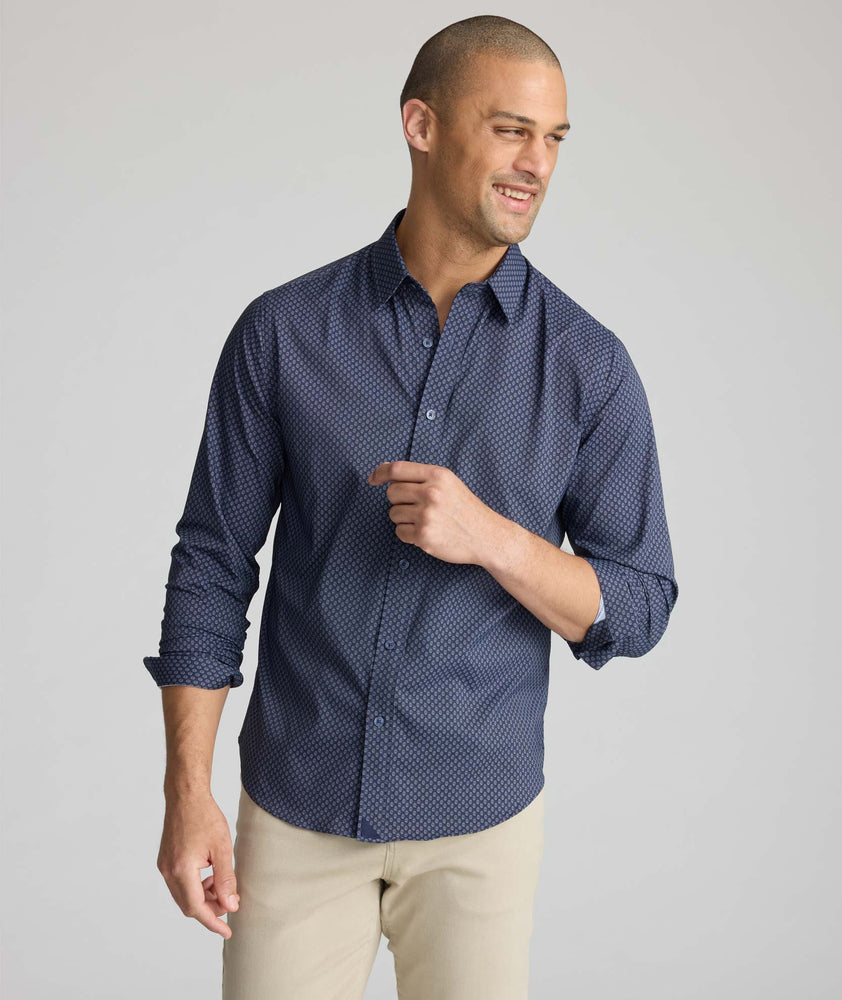 Model wearing a blue UNTUCKit Performance Shirt.