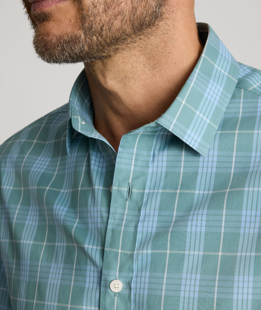 Model is wearing UNTUCKit Lancaster cottontek green shirt. 