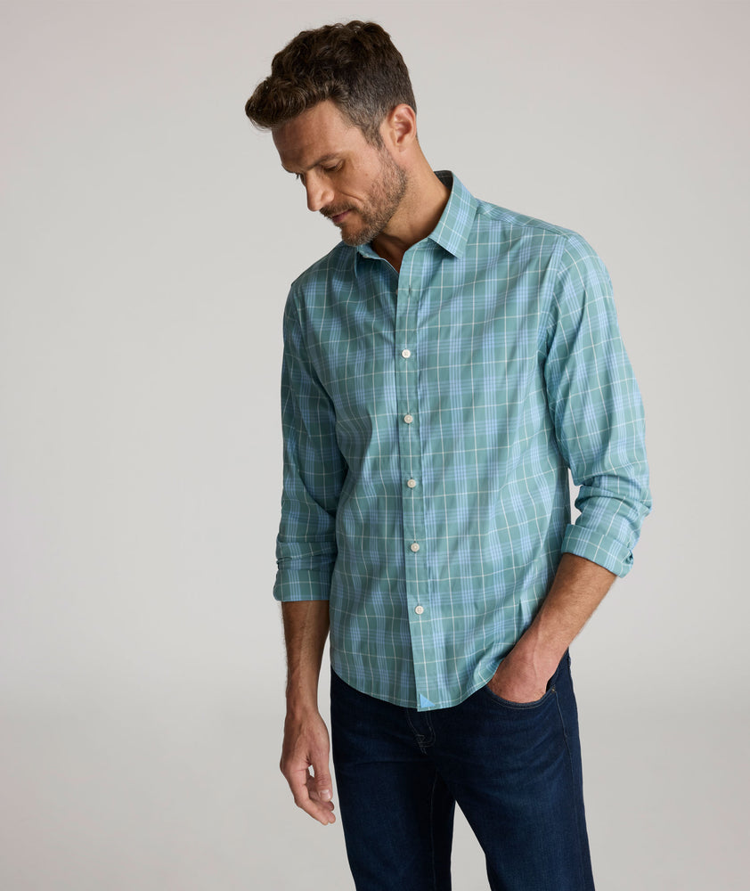 Model is wearing UNTUCKit Lancaster cottontek green shirt. 