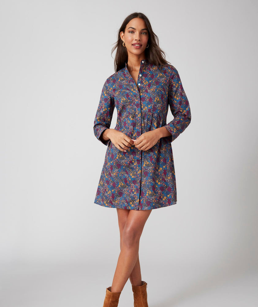 Model is wearing UNTUCKit navy printed Lauren dress.