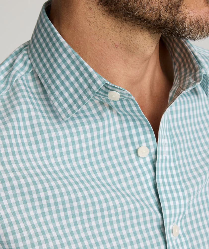 Model is wearing UNTUCKit Lawrence wrinkle-free shirt. 