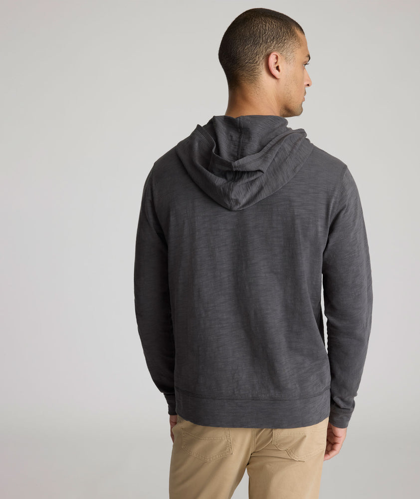 Model is wearing UNTUCKit Lazio Hoodie in Forged Iron