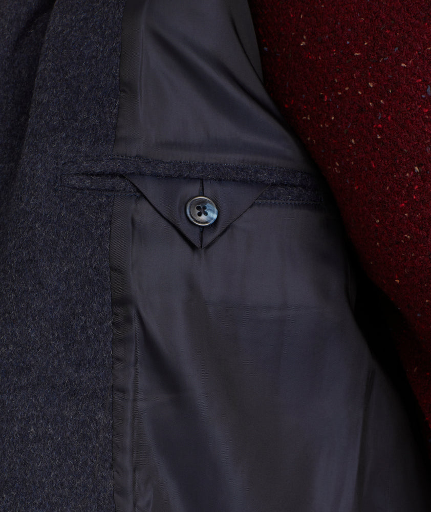 Model is wearing UNTUCKit Wool Blend Topcoat.