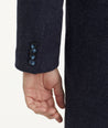Model is wearing UNTUCKit Wool Blend Topcoat.