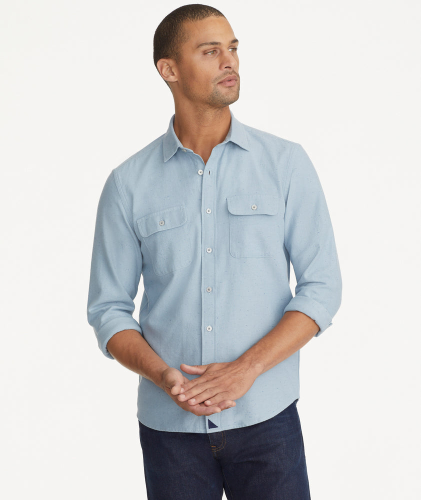 Model is wearing UNTUCKit light blue chambray flannel.