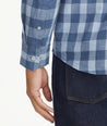 Model is wearing UNTUCKit light blue buffalo check flannel.