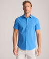 Model is wearing UNTUCKit Performance Short-Sleeve Livingston Shirt in Blue Shark Fin Print.