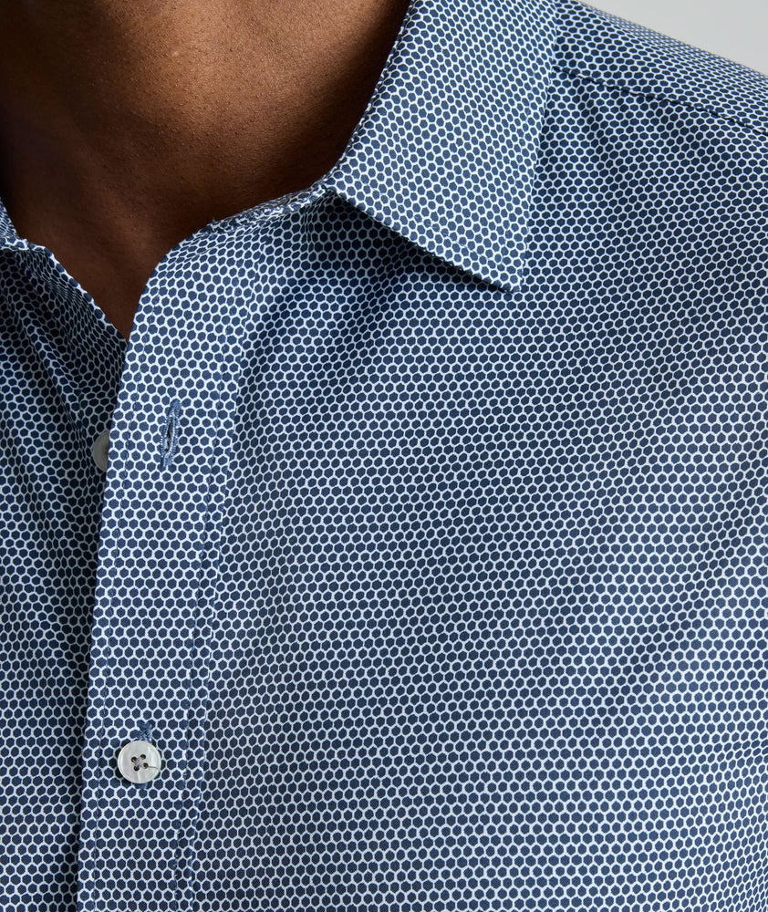 Model is wearing UNTUCKit Performance Short-Sleeve Lobo Shirt in navy.