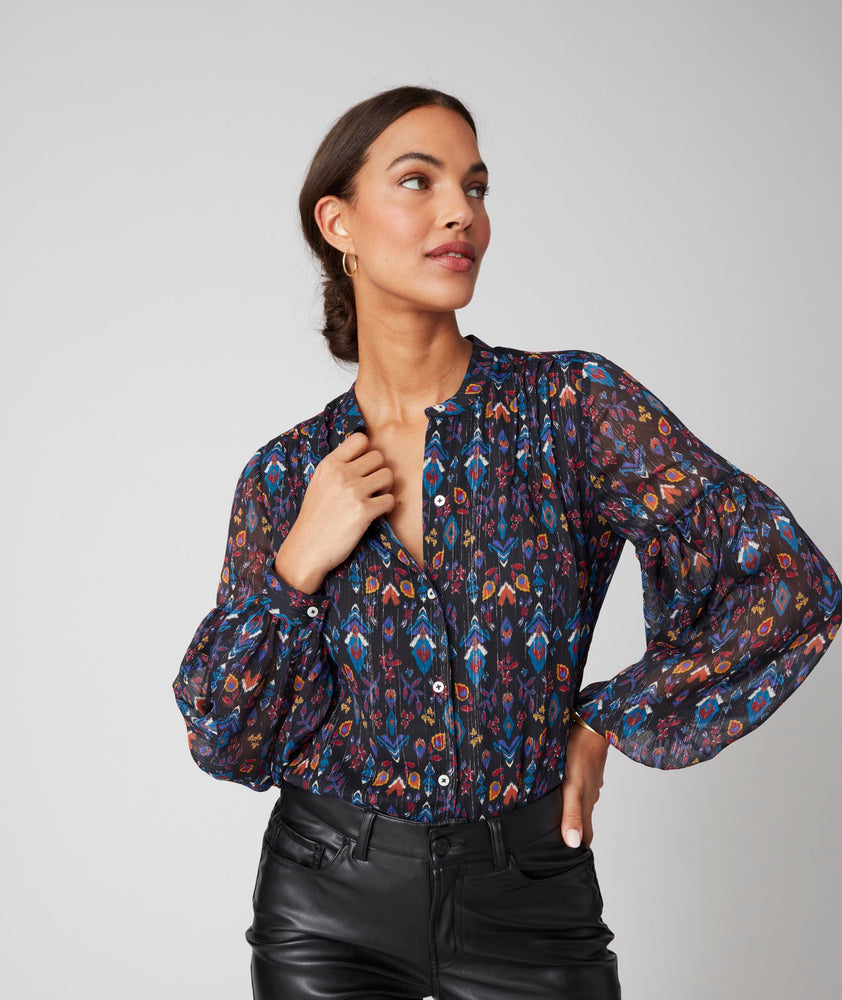 Model is wearing UNTUCKit printed black Lorelei shirt. 