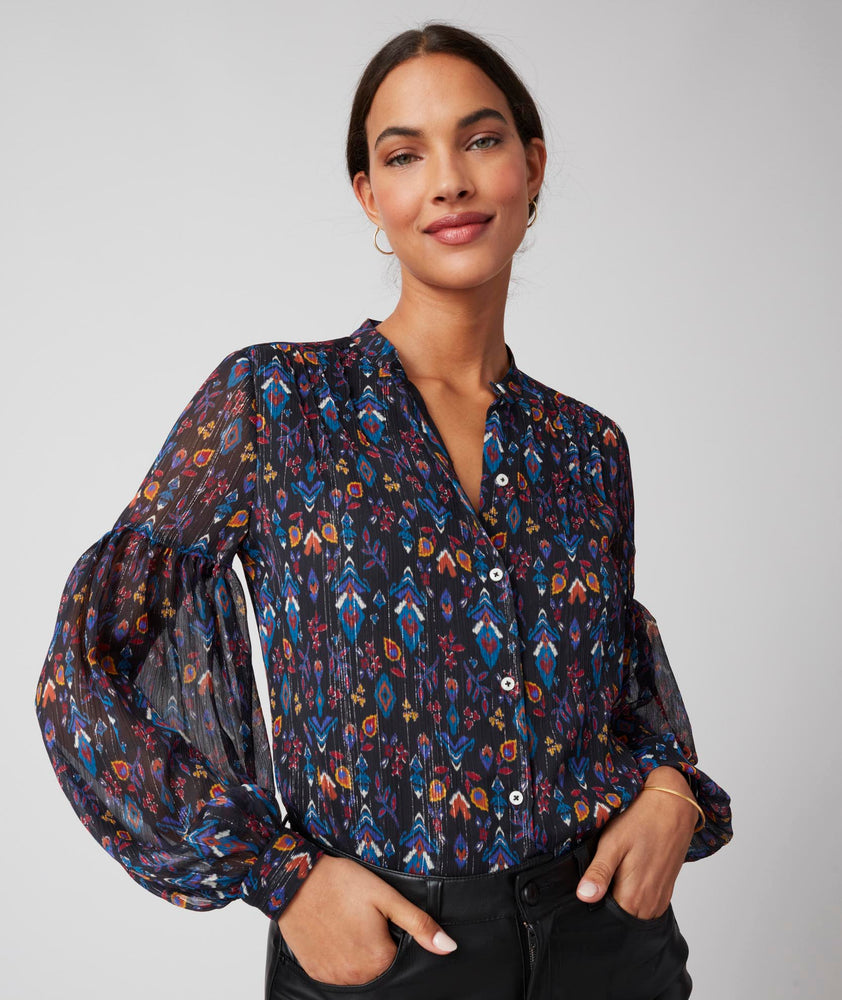 Model is wearing UNTUCKit printed black Lorelei shirt.