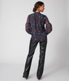 Model is wearing UNTUCKit printed black Lorelei shirt.