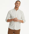 Model is wearing UNTUCKit Wrinkle-Free Lorent Shirt in Olive Tan & Blue Windowpane Check.