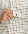 Model is wearing UNTUCKit Wrinkle-Free Lorent Shirt in Olive Tan & Blue Windowpane Check.