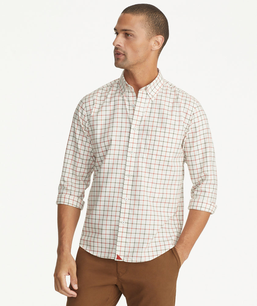 Model is wearing UNTUCKit Wrinkle-Free Lorent Shirt in Olive & Red Windowpane Check.