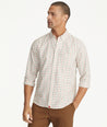 Model is wearing UNTUCKit Wrinkle-Free Lorent Shirt in Olive & Red Windowpane Check.