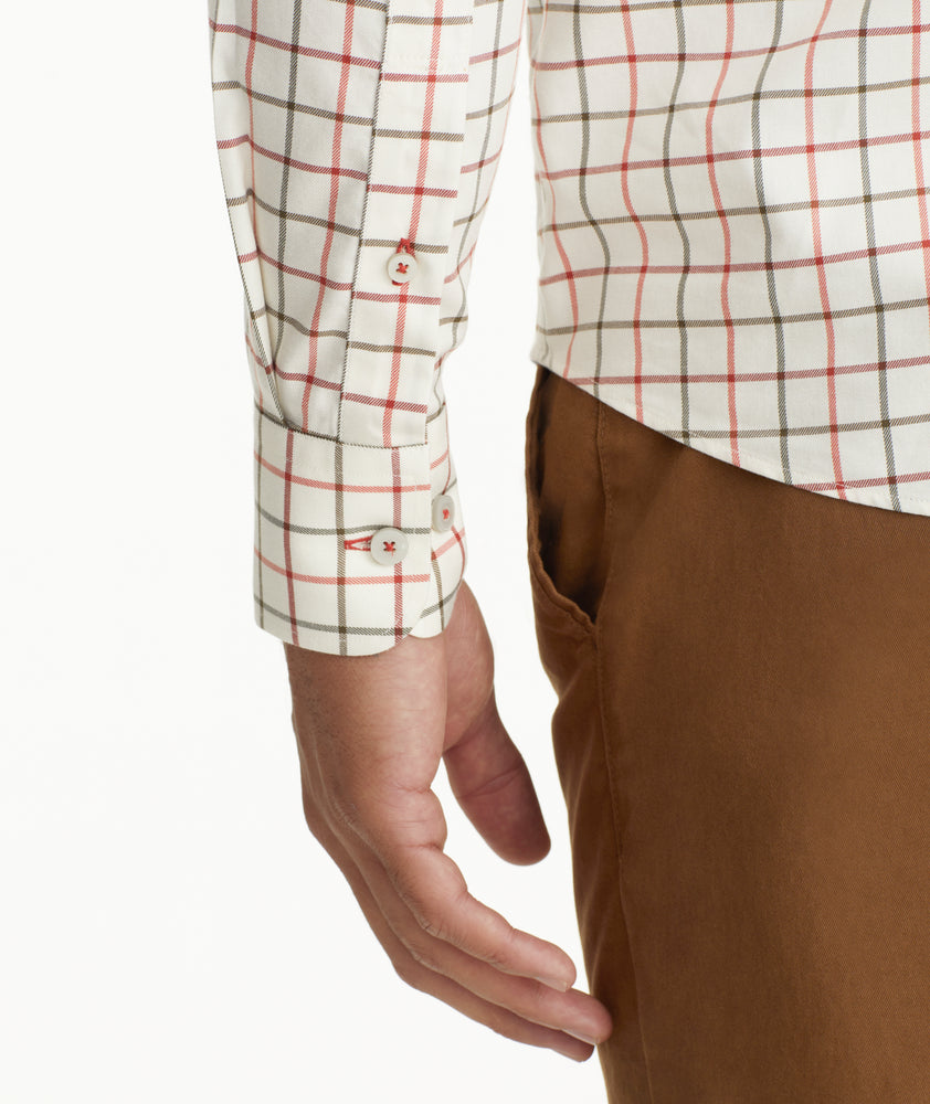 Model is wearing UNTUCKit Wrinkle-Free Lorent Shirt in Olive & Red Windowpane Check.