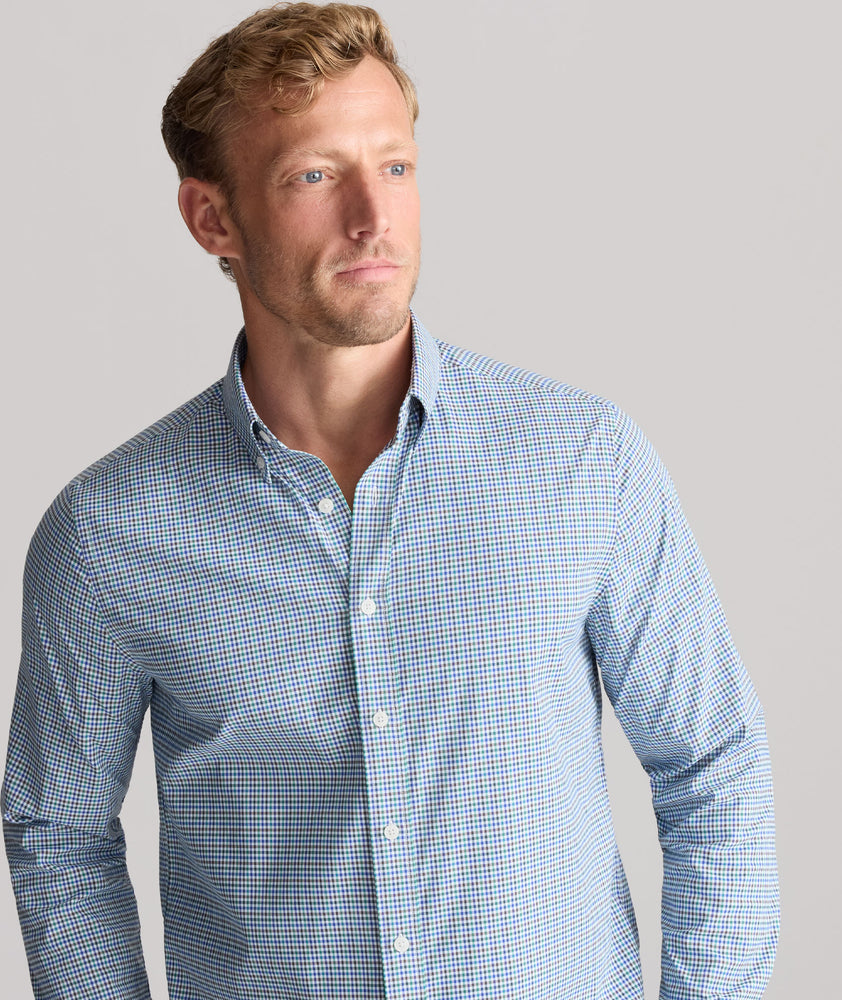 Model is wearing UNTUCKit Performance Lorimar Shirt in blue. 