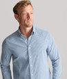 Model is wearing UNTUCKit Performance Lorimar Shirt in blue. 