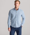 Model is wearing UNTUCKit Performance Lorimar Shirt in blue. 