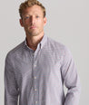 Model is wearing UNTUCKit Performance Lorimar Shirt in red. 