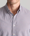 Model is wearing UNTUCKit Performance Lorimar Shirt in red. 
