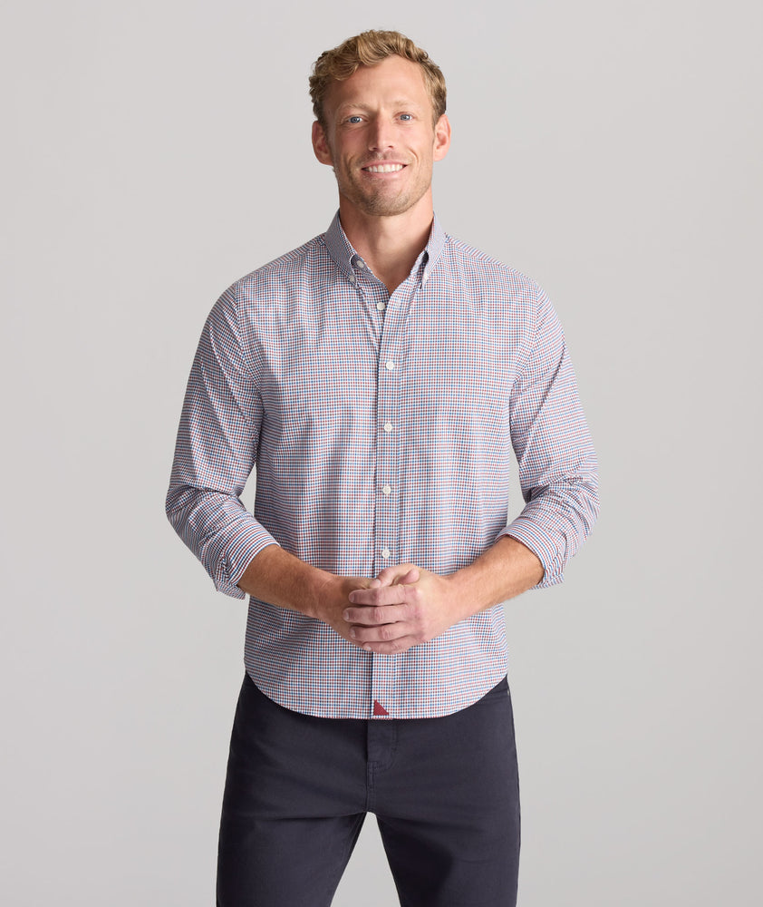 Model is wearing UNTUCKit Performance Lorimar Shirt in red. 