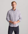 Model is wearing UNTUCKit Performance Lorimar Shirt in red. 