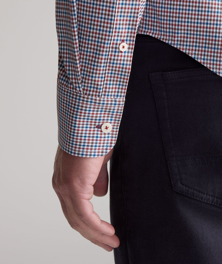 Model is wearing UNTUCKit Performance Lorimar Shirt in red. 