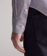 Model is wearing UNTUCKit Performance Lorimar Shirt in red. 